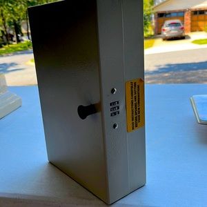 Lockbox that hangs on wall or kept in office desk for company desk keys.